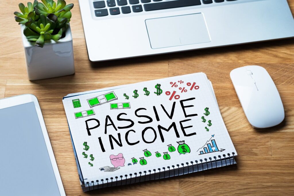 Passive income words in notepad at desk