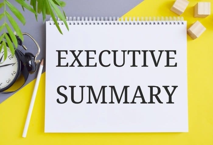 A notepad with a written executive summary for business plan writing