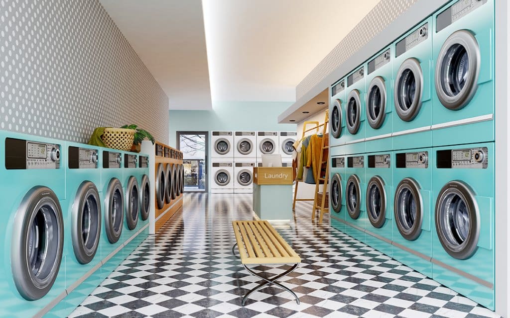 Laundry shop interior with counter and washing machines