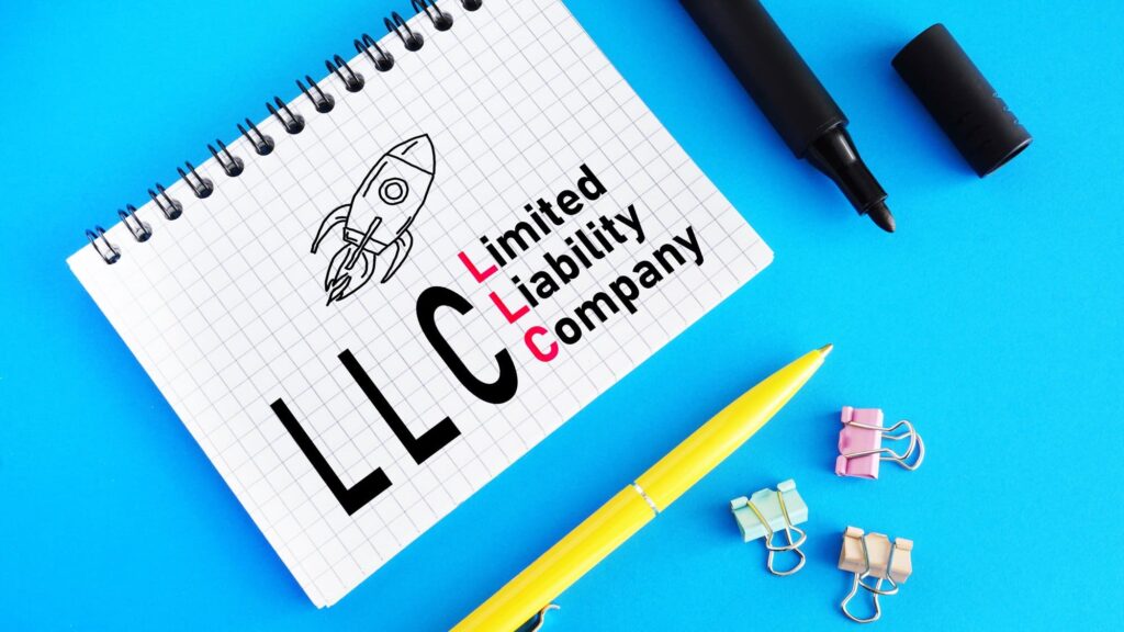 Limited Liability Company LLC shown in notebook