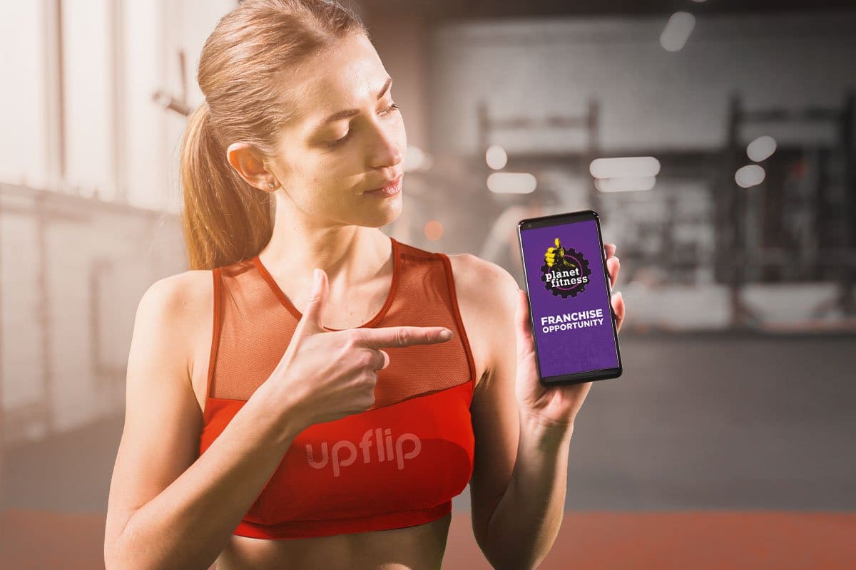 young woman wearing a fitness outfit with a mobile phone