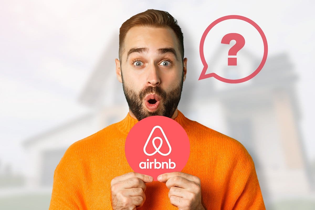 man holding a circle card with airbnb logo