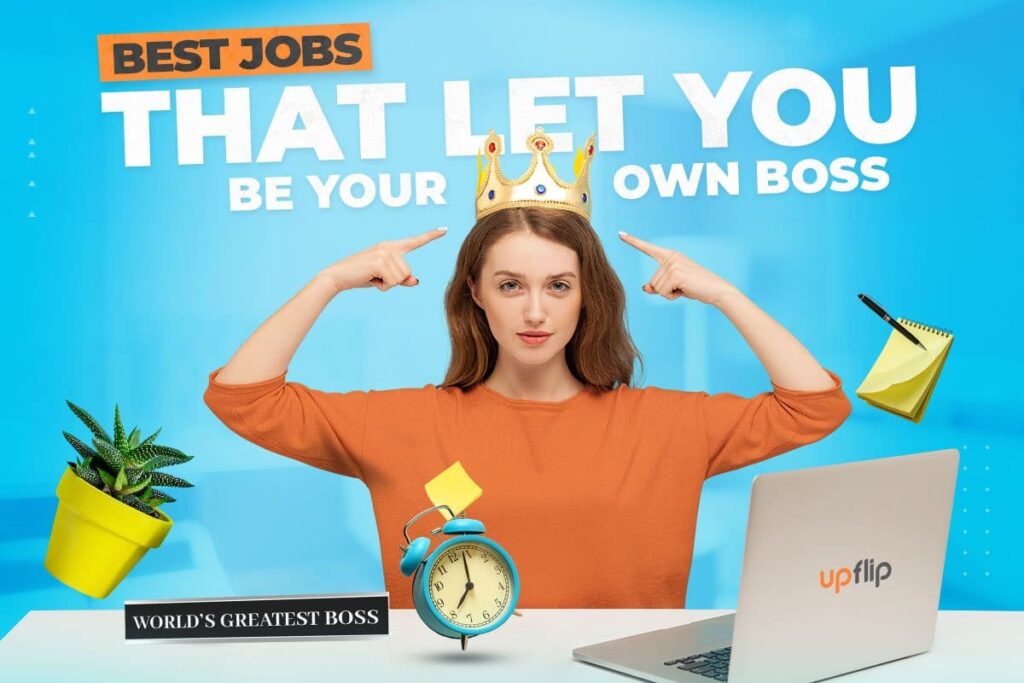 Young self-employed woman pointing to the crown on her head and words "best jobs that let you be your own boss" while sitting at laptop surrounded by alarm clock, notepad, and houseplant