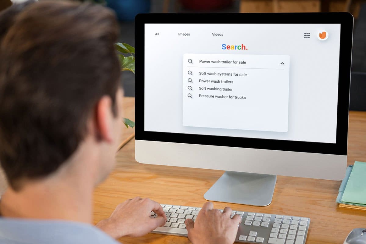 Best Pressure Washer Trailer Setup (2025) 13 Businesses owner at desktop computer running web search for pressure wash trailers