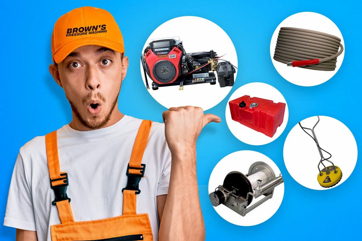 Best Pressure Washer Trailer Setup (2025) 7 Concept of Brown’s employee gesturing to essential parts for soft wash trailers including hoses, motor, and reels