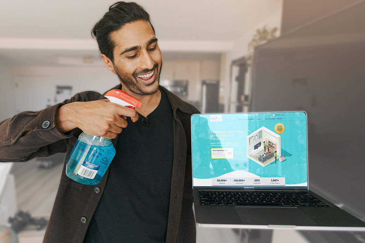 Remote business founder Neel Parekh cleaning a laptop