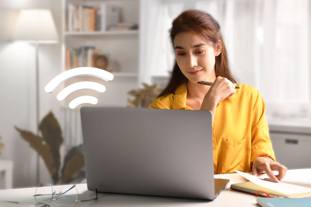 Woman using WiFi internet connection to run a business while traveling