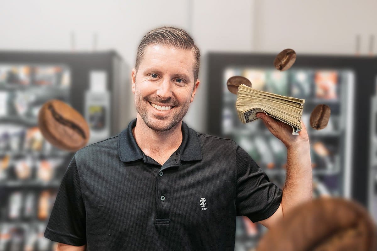 Concept of Adam Hill holding cash and surrounded by coffee beans in foreground with coffee systems and vending machines in background