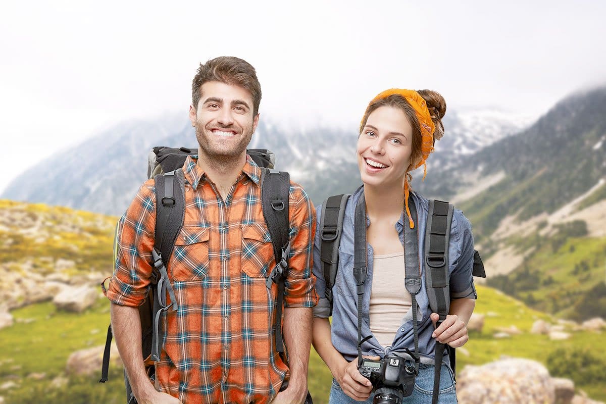 Couple leading backpacking group