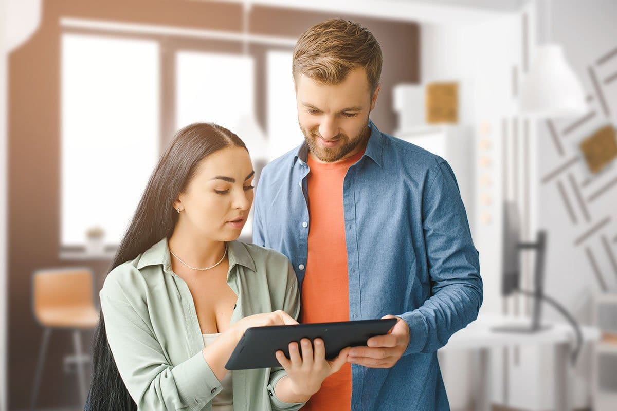Couple looking at a tablet