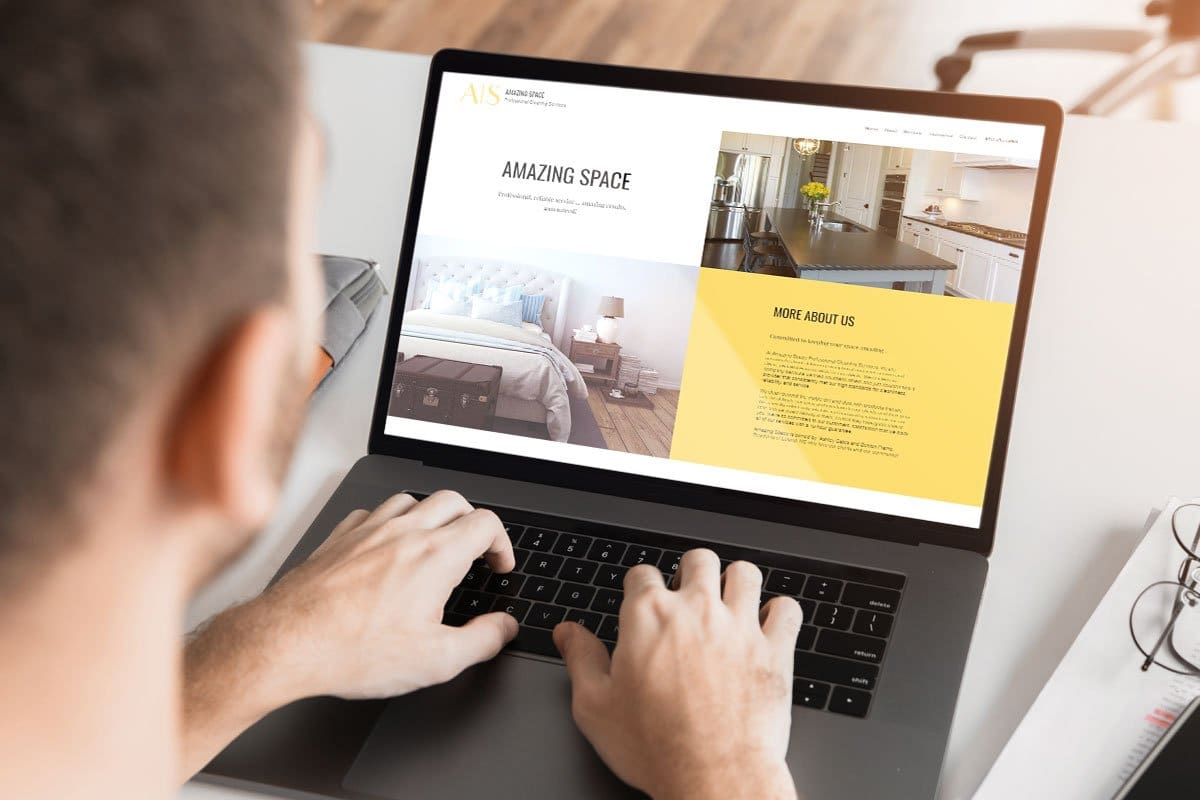 Cleaning Business Website 7-Step Guide 6 Amazing Space’s minimalist, modern homepage design shown on a laptop situates them as a luxury service