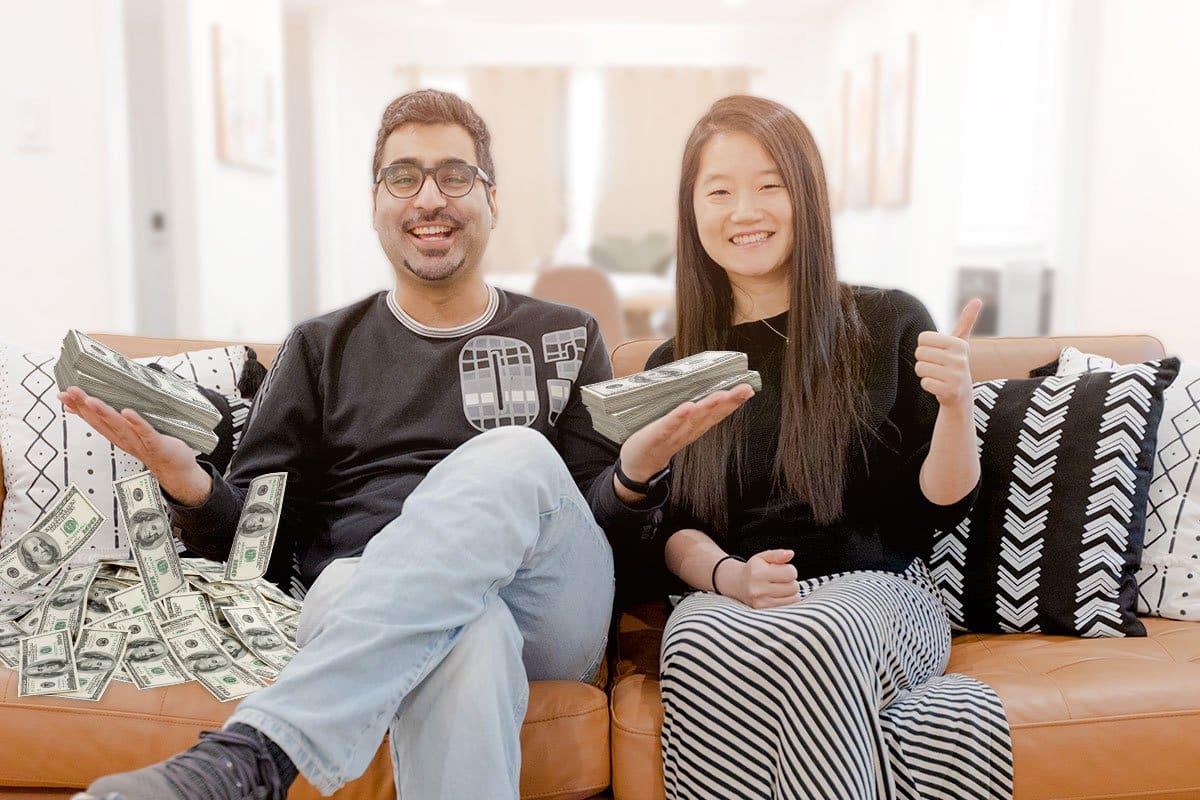 Sid and Eva of NICASA sitting on couch holding cash and giving a thumbs up