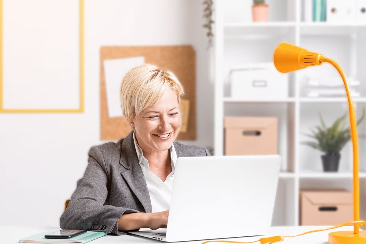 How to Start a $15M/Year ATM Business 13 Middle-aged woman ATM business owner working in a bright and tidy home office