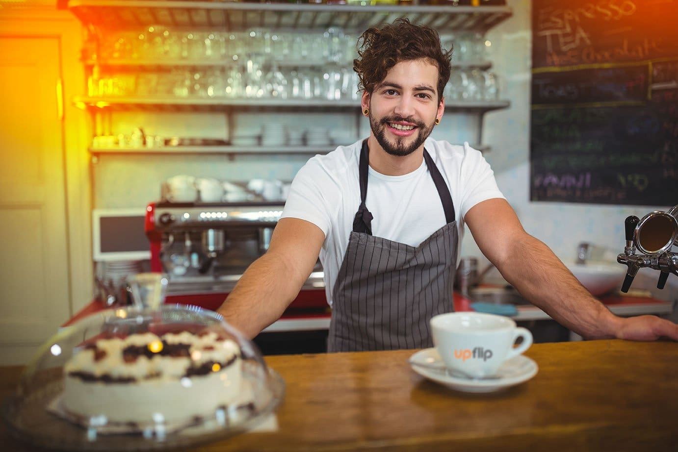 How to Open a Coffee Shop and Grow It to 19 Locations (2025) 10 Waiter at the coffee shop