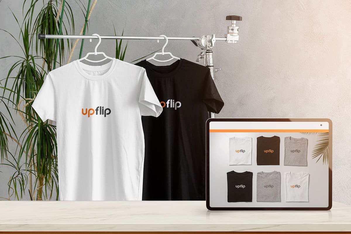 23 eCommerce Business Ideas You Can Start Today 4 Print-on-demand t-shirts with UpFlip logo showing on hangers and pictured on a tablet