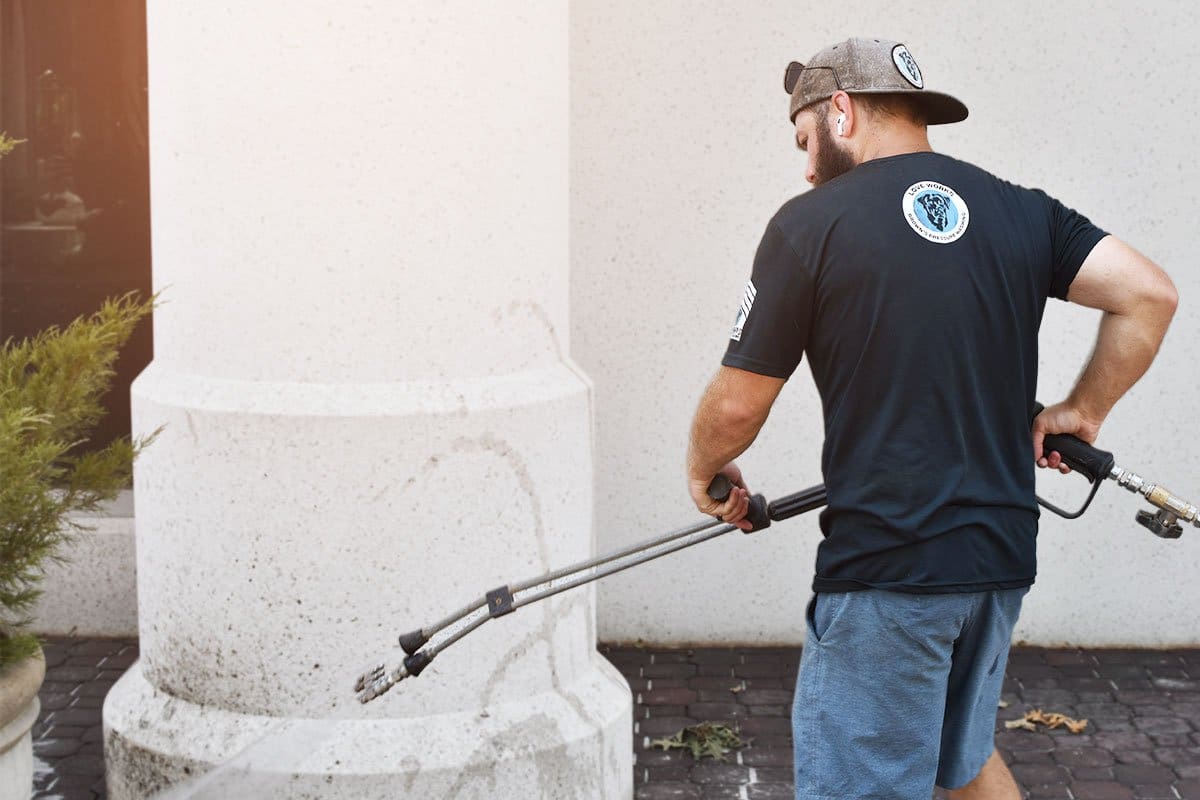 Brown’s employee cleaning the bricks around a residential home