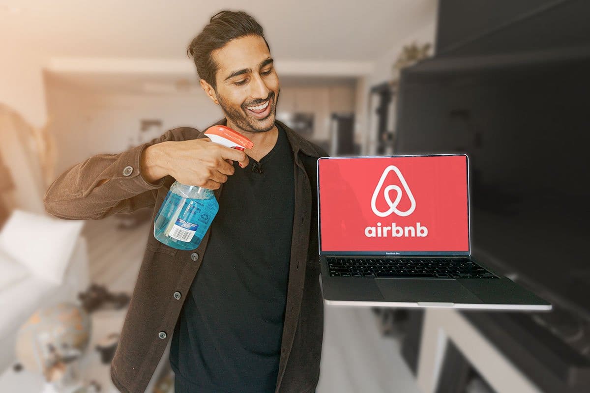 MaidThis CEO using a spray bottle of Windex to clean a MacBook Pro showing the Airbnb logo