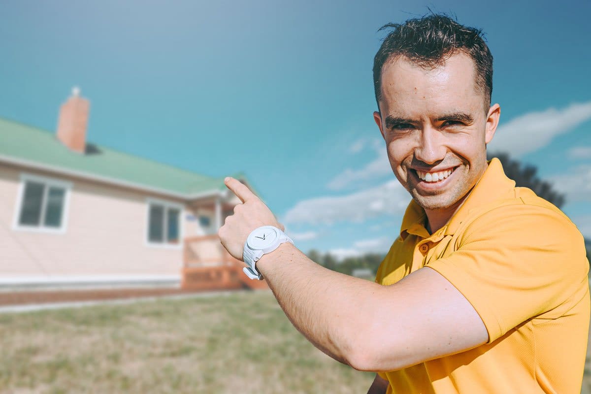 How to Become an Entrepreneur in 13 Steps 6 Mike pointing to a residential property in the background