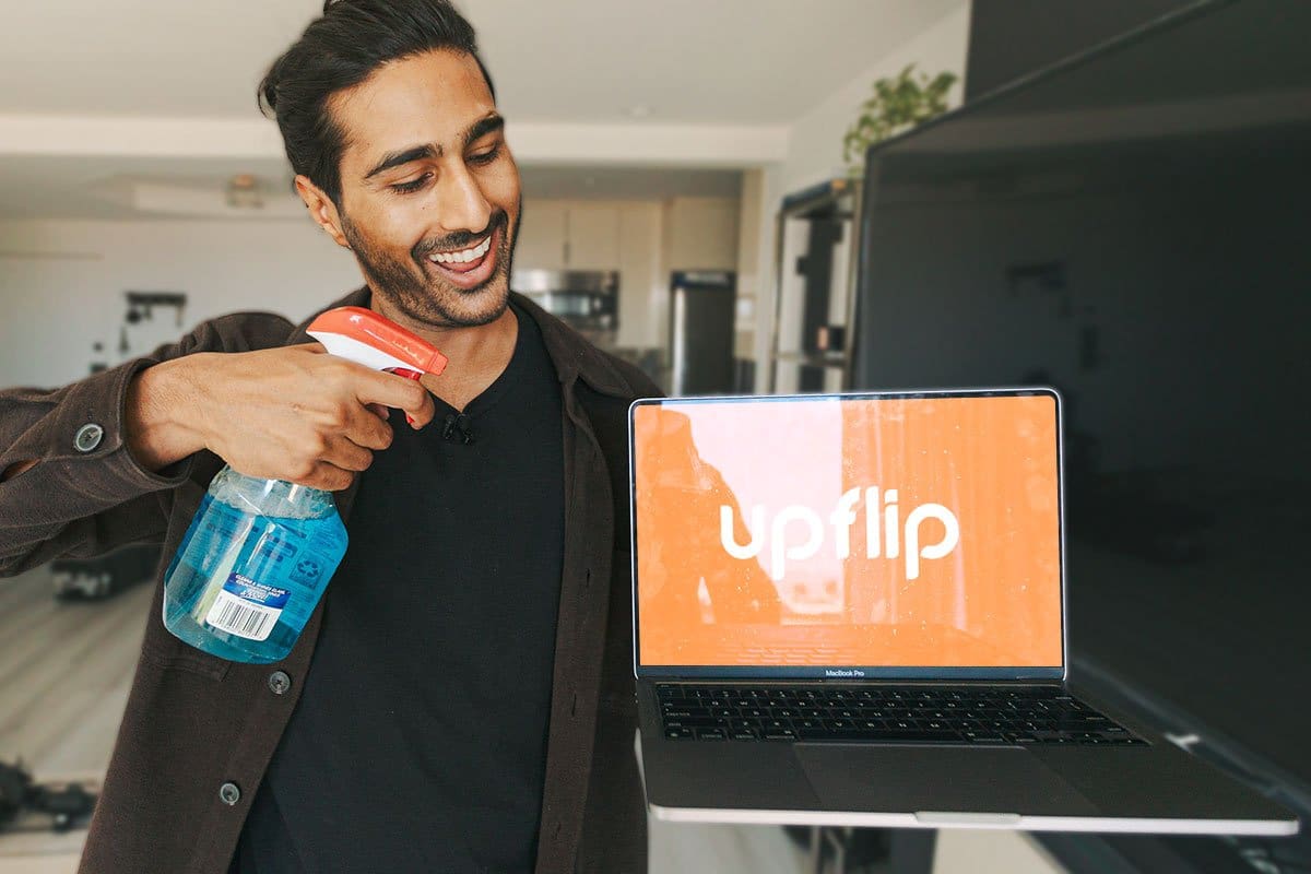 How to Become an Entrepreneur in 13 Steps 13 Neel cleaning a laptop with Windex