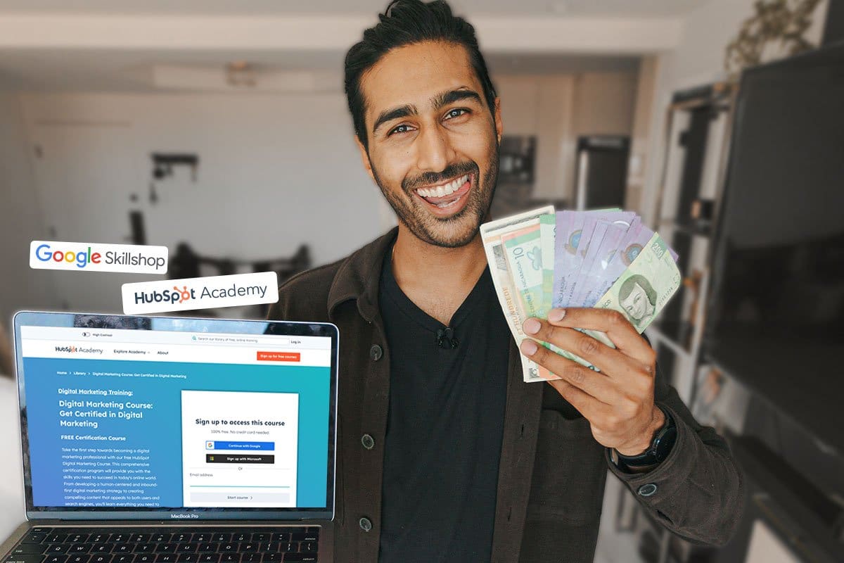 How to Become an Entrepreneur in 13 Steps 5 Neel smiling playfully while holding a laptop in one hand and international currency in the other