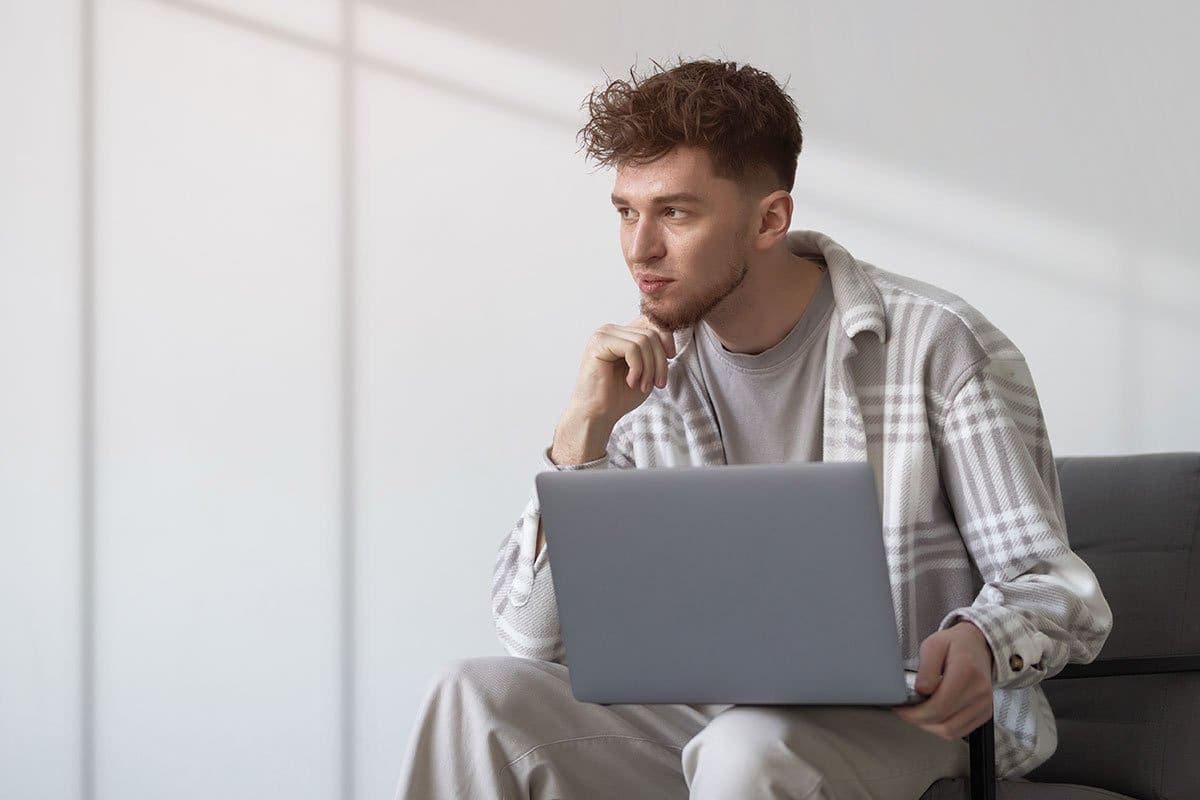 47 Best Side Hustle Ideas (for 2025) 9 Young man considering side hustles