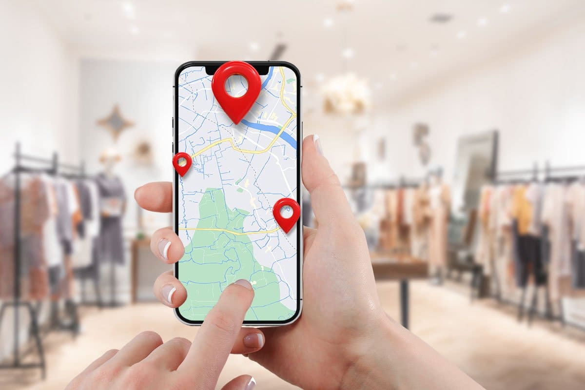 276 Boutique Names (for 2025) 4 Boutique locations on a smart phone map app held up in a trendy boutique space