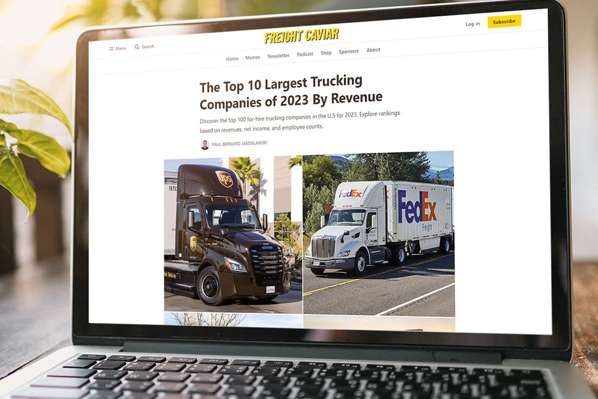 Freight Caviar article about the 10 largest trucking companies of 2023 on a laptop