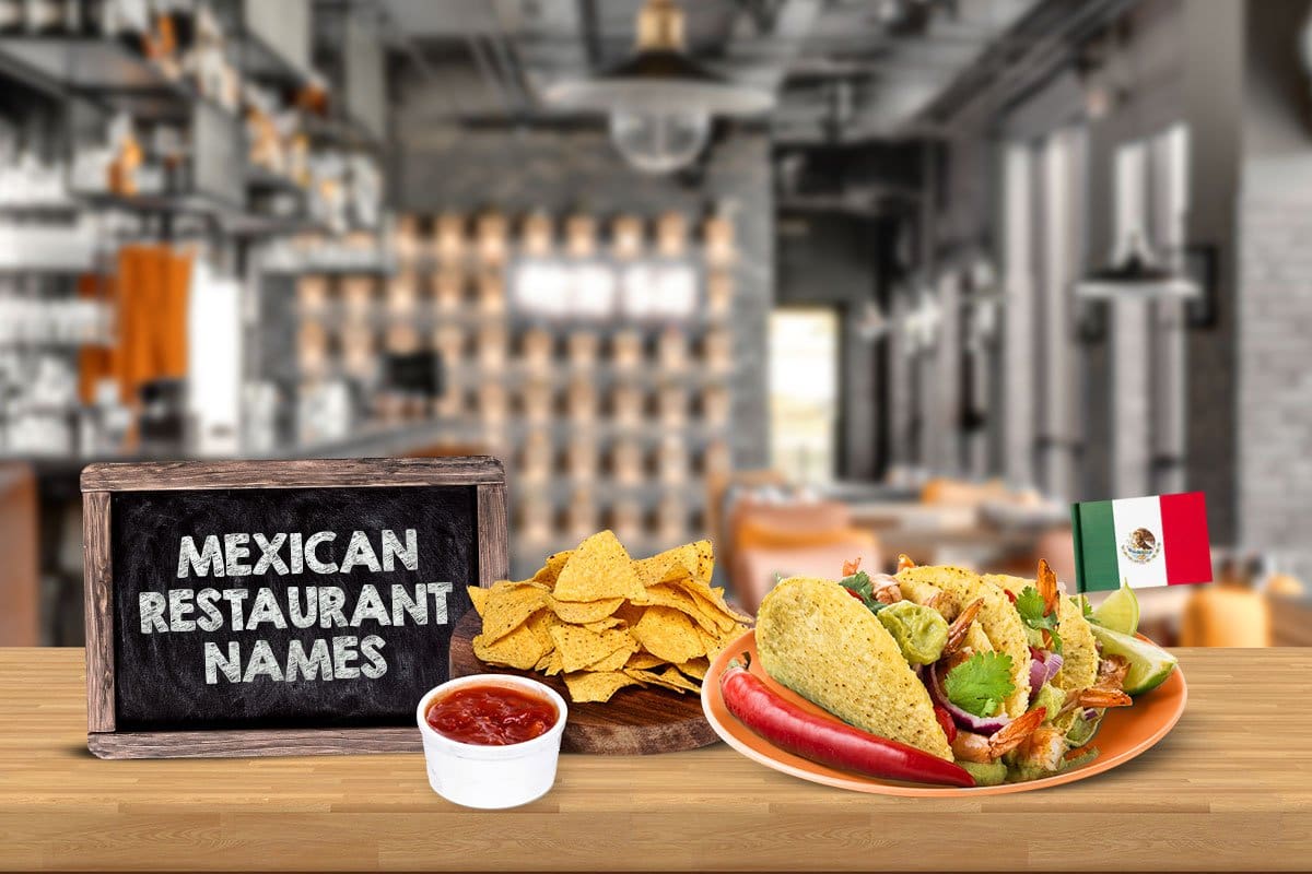 466 Restaurant Name Ideas You’ll Love (2025) 3 A Mexican food spread including salsa, chips, and shrimp tacos with a tiny Mexican flag in them next to a chalk board plaque that reads "Mexican restaurant names"
