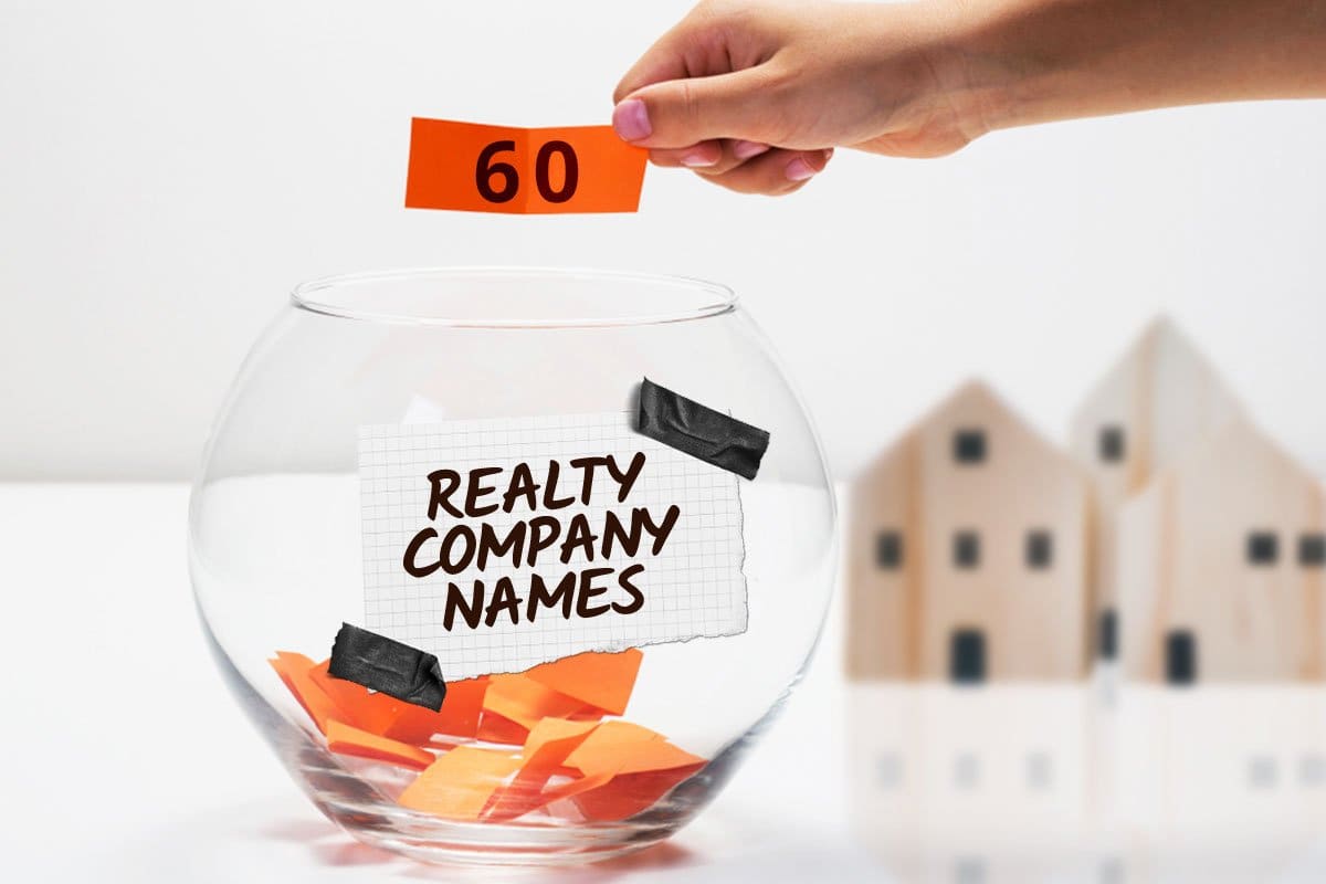 Fishbowl with scraps of orange paper inside and a label that reads "realty company names" taped on the outside