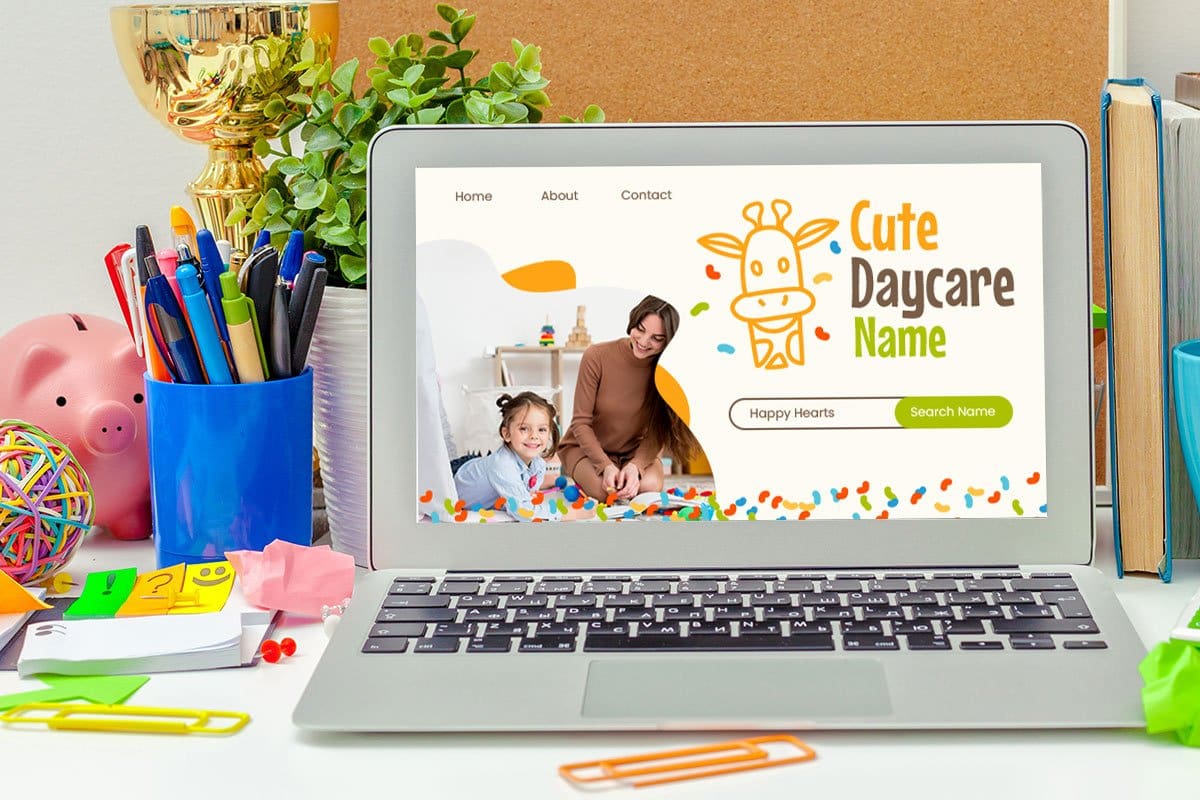 698 Endearing Daycare Names (2025) 3 Daycare owner’s desk with cup of pens, piggy bank, books, cork board, a ball of rubber bands, and a laptop showing a search for cute daycare names