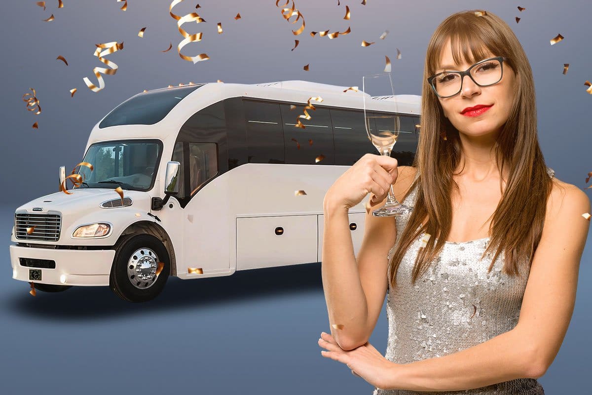 Woman in a sequined dress holding a glass of champagne in front of a party bus