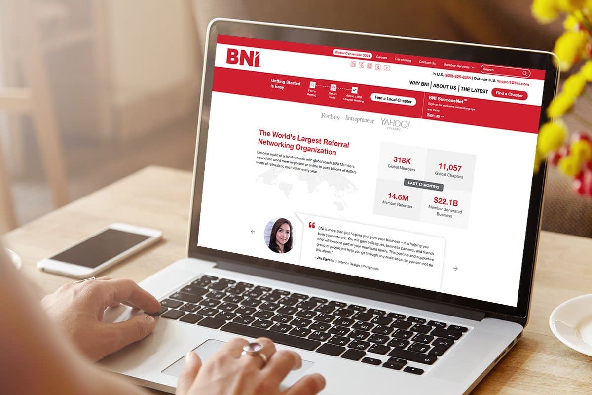 A woman perusing BNI’s website on a laptop