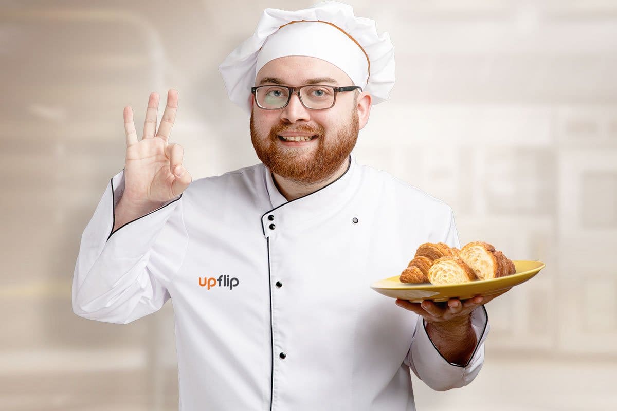 Chef holding a plate with bread