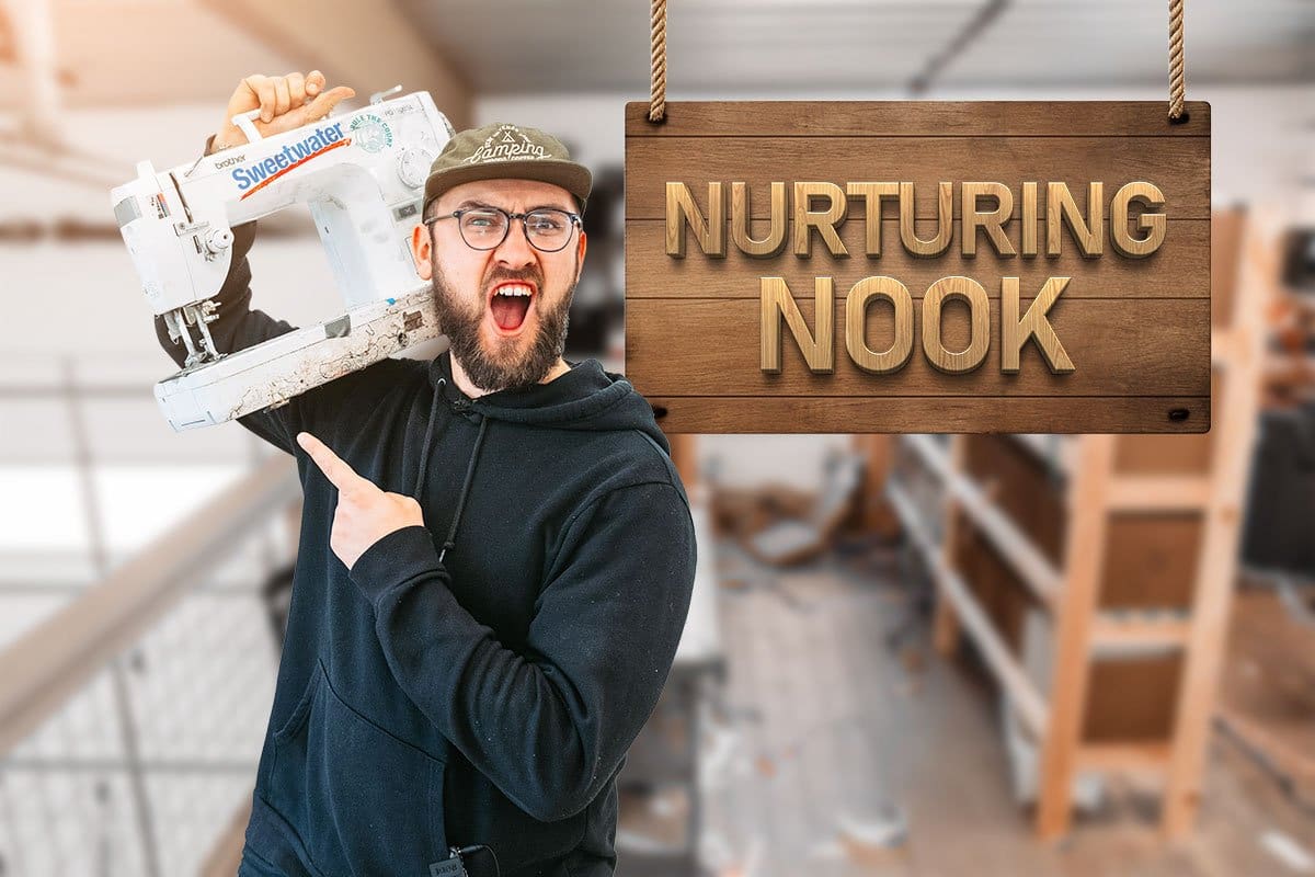 522 Etsy Shop Names You’ll Love (2025) 6 TagPup owner Vlad standing next to a wooden sign that reads "Nurturing Nook"