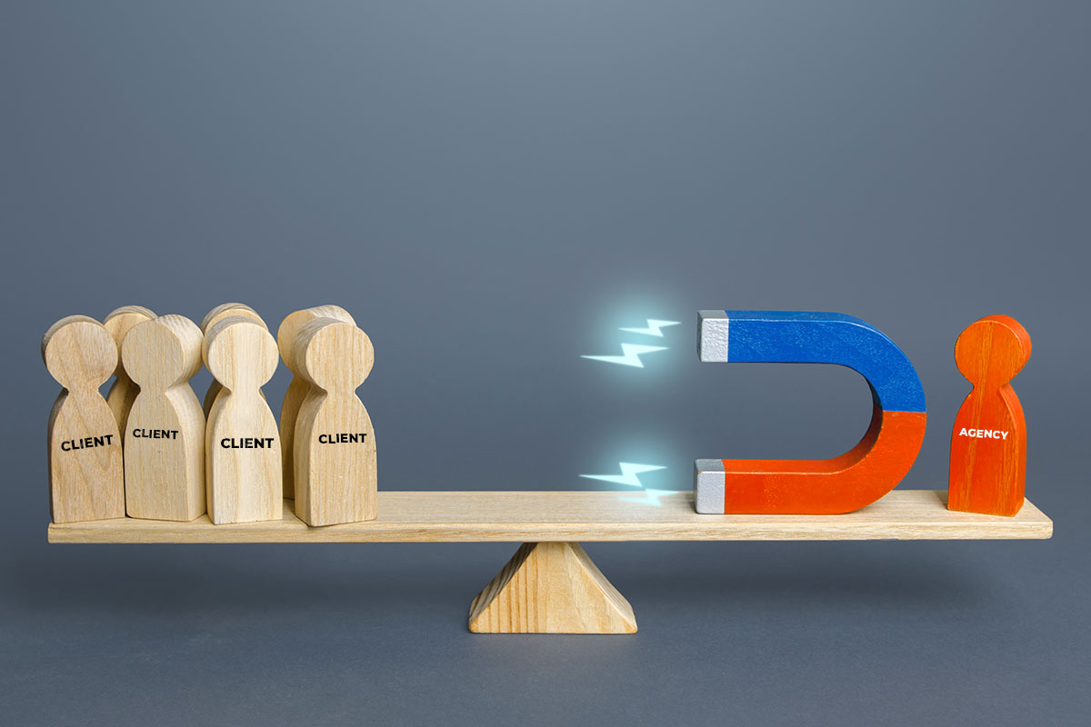 How to Start a $2.88M/Year Recruiting Business 3 Concept of a recruitment agency attracting clients showing wood block figures, one labeled "agency" with a horseshoe-shaped magnet next to it and others labeled "client"