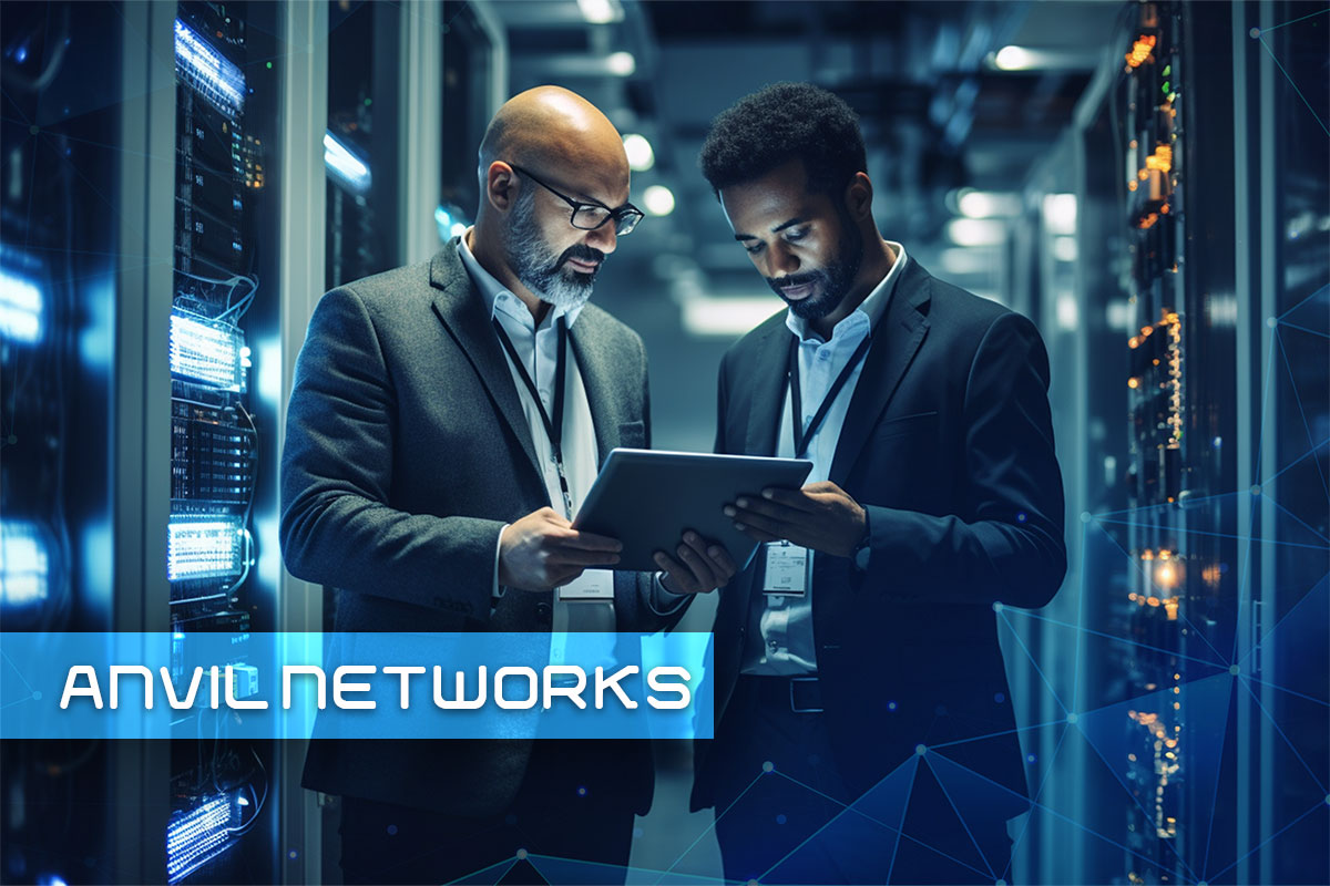290 Consulting Company Names 7 Two businessmen stand in a data center and examine a tablet; text saying "Anvil Networks" hovers in the bottom left corner
