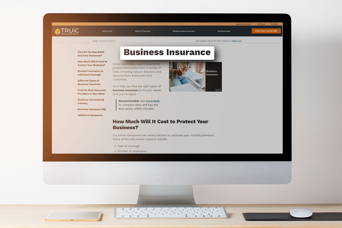 Business insurance article on a desktop computer