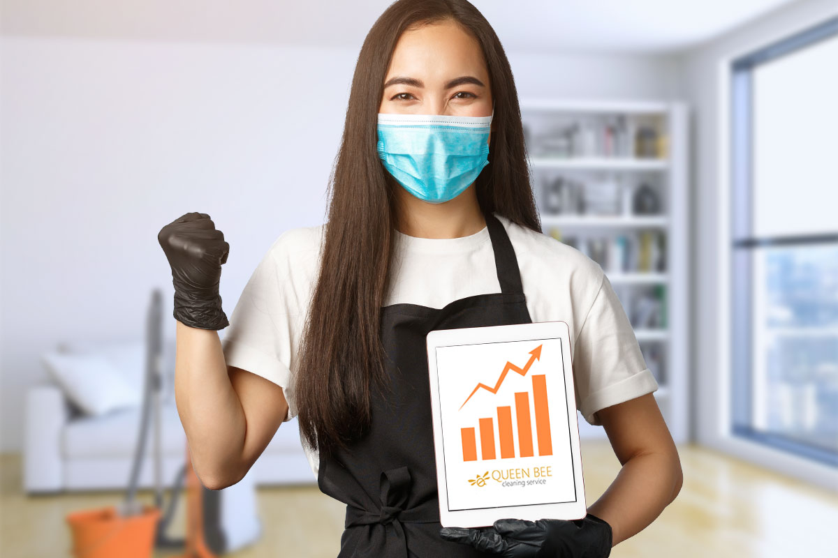 17 Catchy House Cleaning Ads, Ideas, and Examples 4 Cleaner holding a tablet showing an upward trending graph