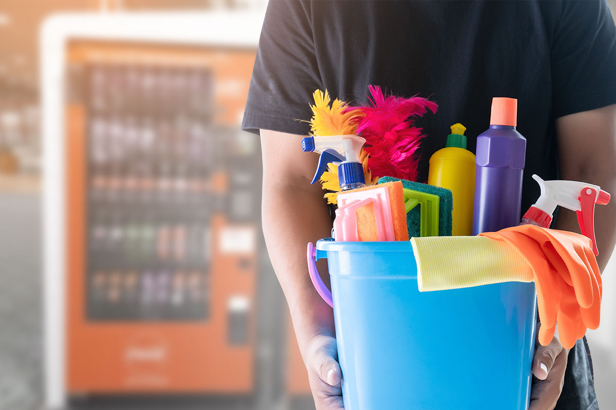 Man holding a cleaning equipment on a bucket
