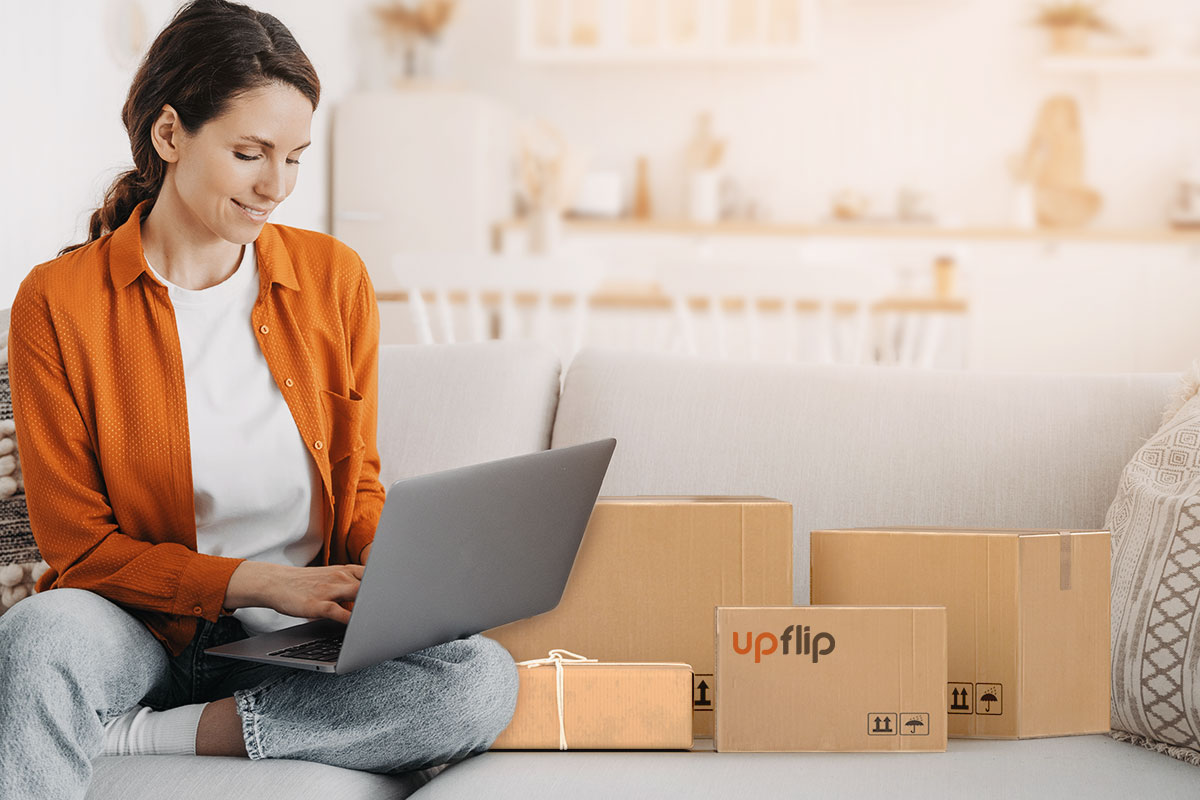 woman working on a laptop at the couch