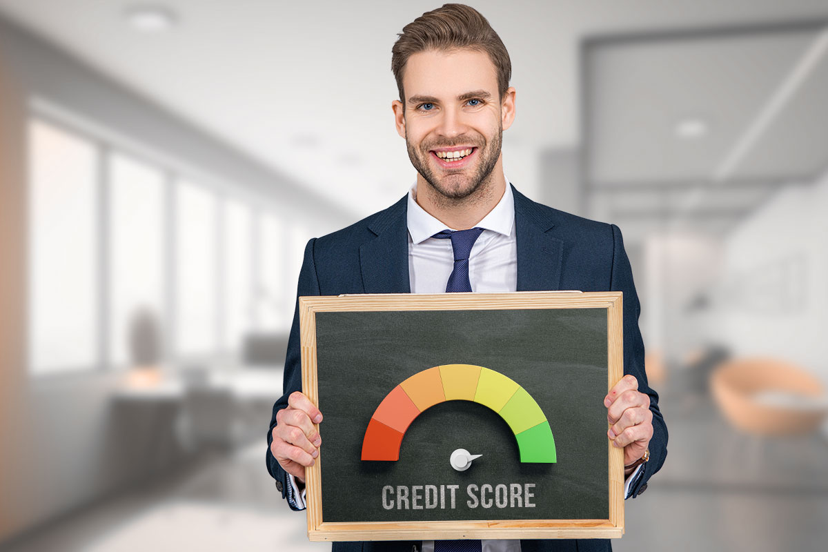 How to Build Business Credit: 6-Step Guide (2025) 6 Business man holding a credit score meter