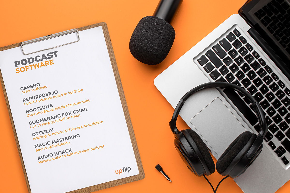How to Start a Podcast: The Ultimate Guide (2025) 16 laptop, microphone, headphone and a paper holder board on orange surface