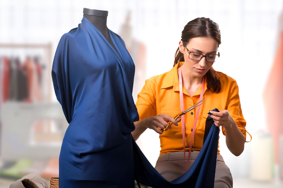 31 Best Self-Employment Ideas (2025) 6 woman with scissors designing a dress