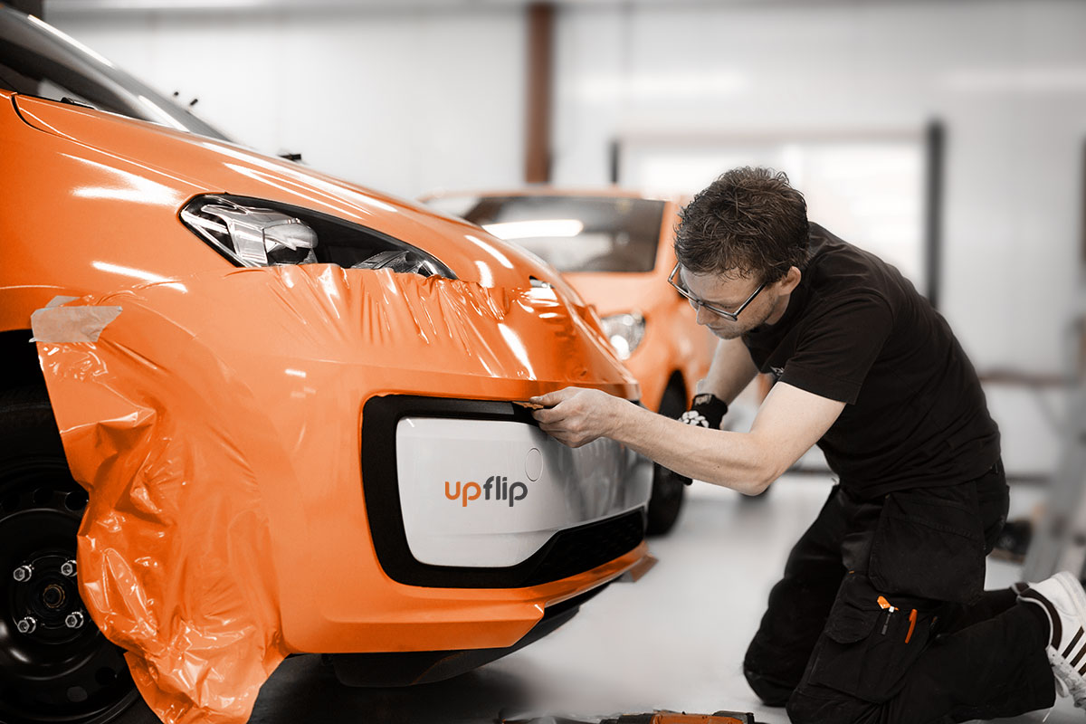 31 Best Self-Employment Ideas (2025) 5 man installing an orange sticker to a car