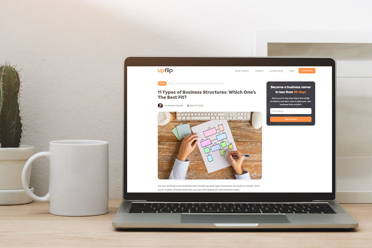 An open laptop showing an UpFlip blog about business structures.