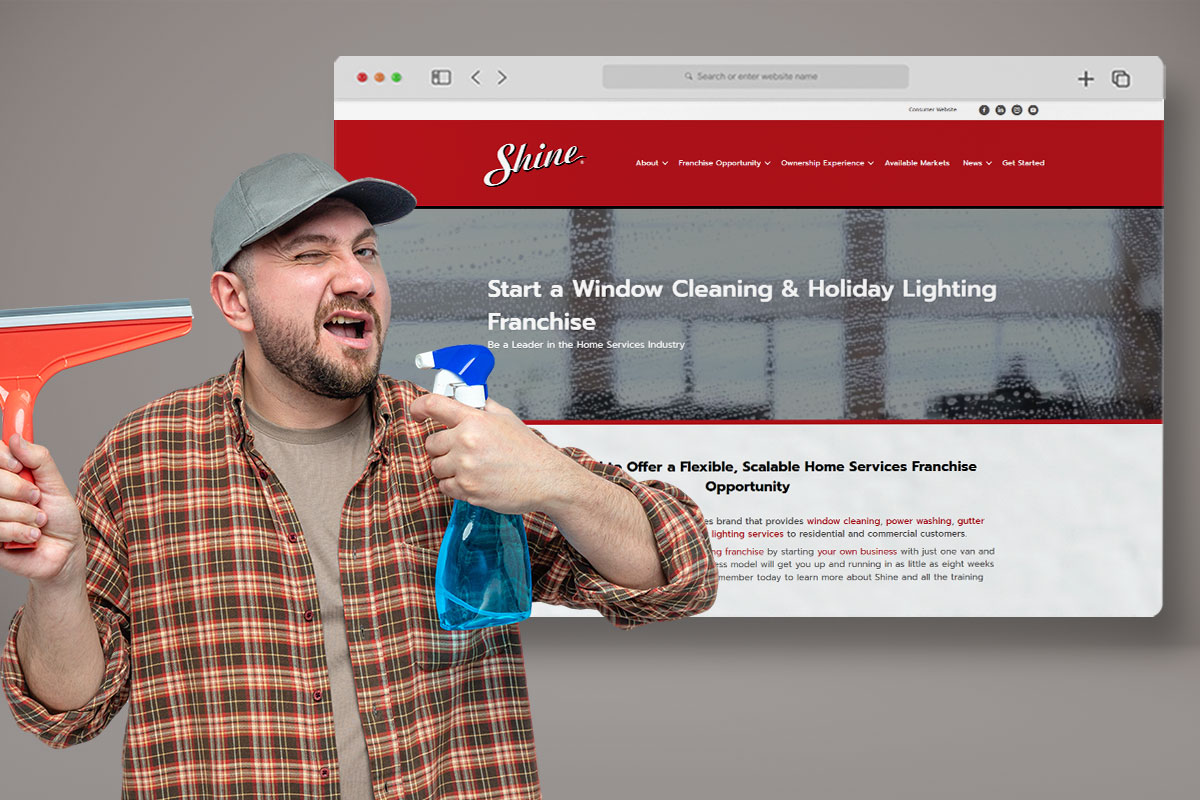 Casually dressed man with cleaning spray and equipment winking in front of a screenshot of a Shine franchise webpage