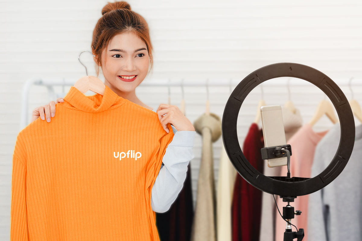 beautyful young woman showin a sweat shirt on the phone