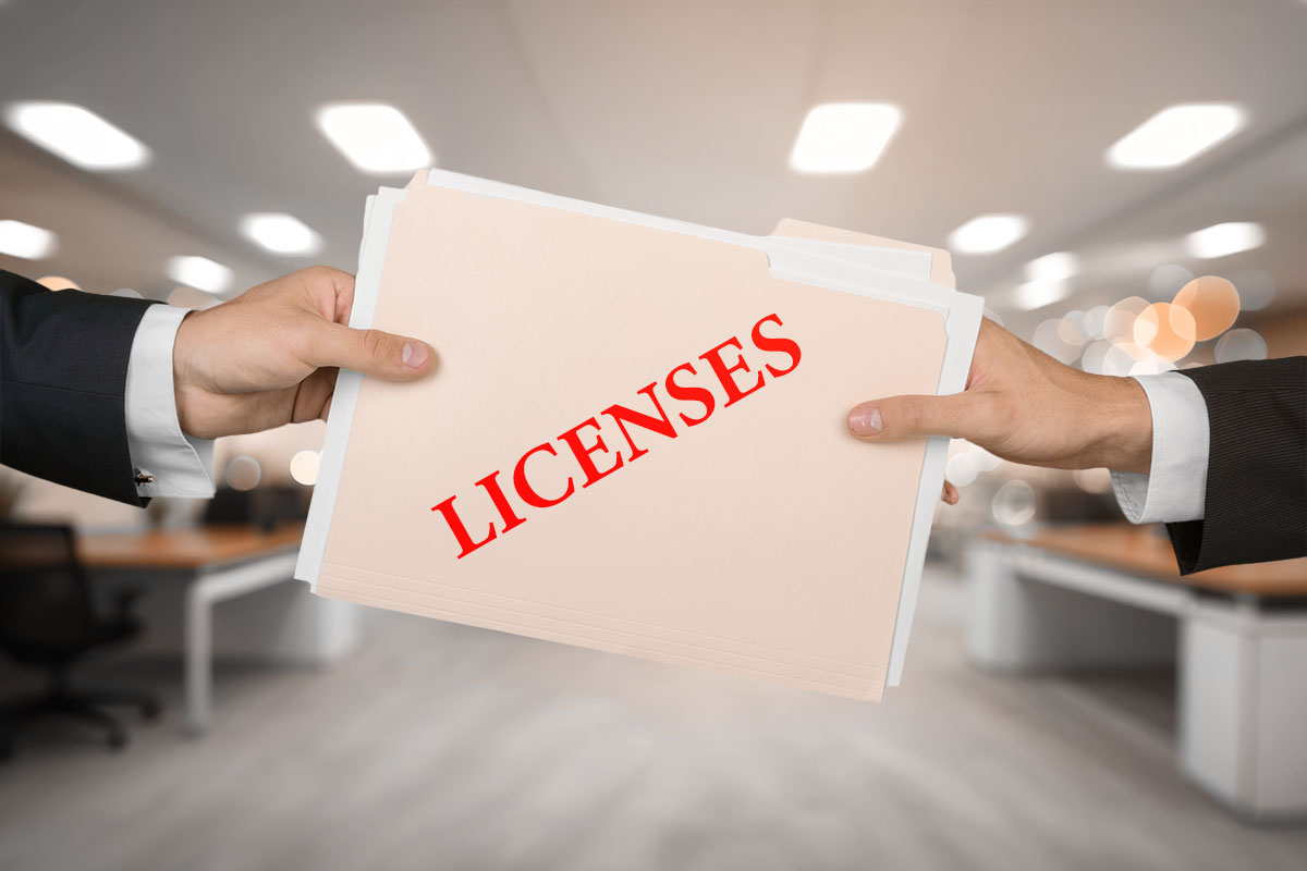 How to Open a Shoe Store 8 Hands holding a folder that says "licenses"