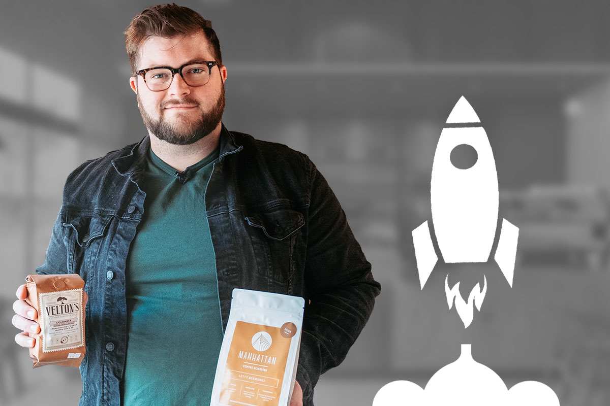 How to Work for Myself 14 Owner of Narrative Coffee holding two bags of coffee beans next to a cartoon rocket taking off