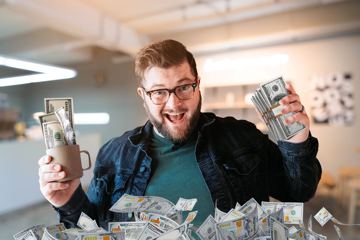 How to Work for Myself 13 Owner of Narrative Coffee holding hundred-dollar bills and a mug